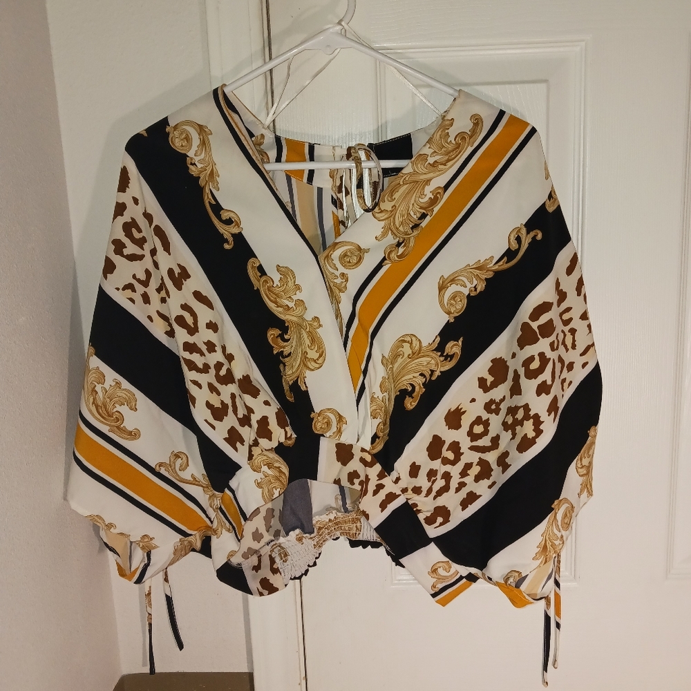 Thrifted blouse with open back